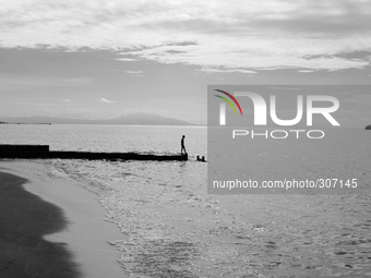 A lone fisherman on Dili beach (