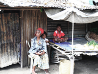 Grandma minding children at a Market near Dili. (