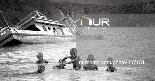 Kids having fun in the sea not far from central Dili. 