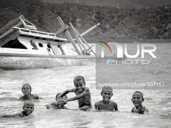 Kids having fun in the sea not far from central Dili. (