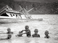 Kids having fun in the sea not far from central Dili. (