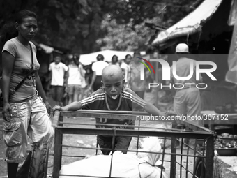 A young boy working for $1 a day at one of Timor Leste's markets. (