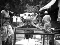 A young boy working for $1 a day at one of Timor Leste's markets. (