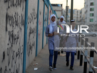 palestinian school girls walk at the Gaza City, on the first day of a new school year, in Gaza City August 29, 2018. 
 (