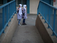 palestinian school girls walk at the Gaza City, on the first day of a new school year, in Gaza City August 29, 2018. 
 (