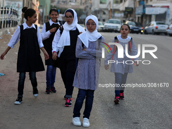 palestinian school girls walk at the Gaza City, on the first day of a new school year, in Gaza City August 29, 2018. 
 (