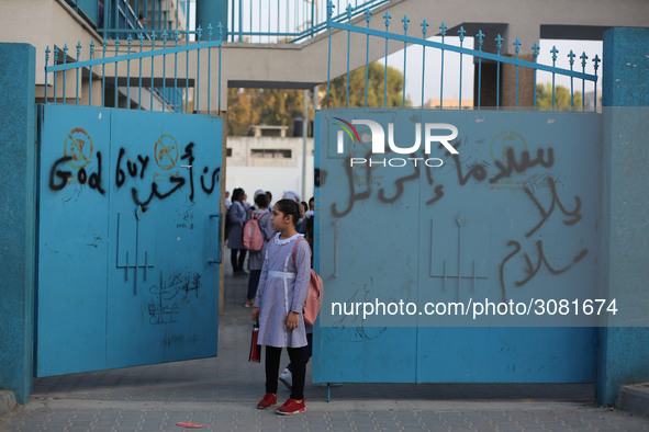 palestinian school girls walk at the Gaza City, on the first day of a new school year, in Gaza City August 29, 2018. 
 