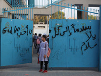 palestinian school girls walk at the Gaza City, on the first day of a new school year, in Gaza City August 29, 2018. 
 (