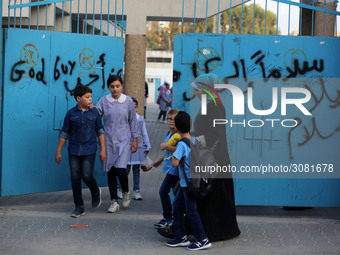 palestinian school girls walk at the Gaza City, on the first day of a new school year, in Gaza City August 29, 2018. 
 (