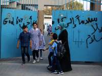 palestinian school girls walk at the Gaza City, on the first day of a new school year, in Gaza City August 29, 2018. 
 (