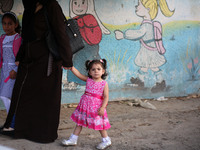 palestinian school girls walk at the Gaza City, on the first day of a new school year, in Gaza City August 29, 2018. 
 (