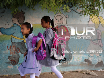 palestinian school girls walk at the Gaza City, on the first day of a new school year, in Gaza City August 29, 2018. 
 (