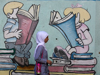 palestinian school girls walk at the Gaza City, on the first day of a new school year, in Gaza City August 29, 2018. 
 (