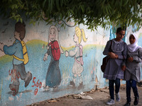 palestinian school girls walk at the Gaza City, on the first day of a new school year, in Gaza City August 29, 2018. 
 (