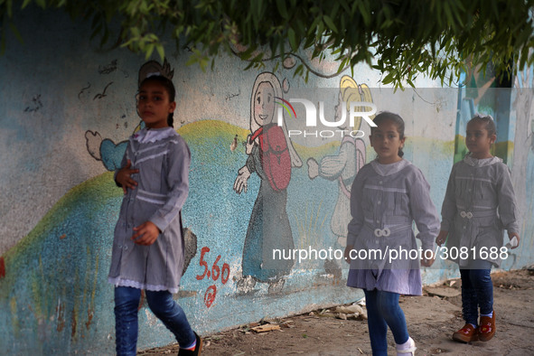 palestinian school girls walk at the Gaza City, on the first day of a new school year, in Gaza City August 29, 2018. 
 