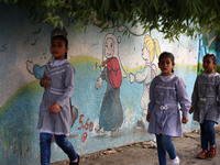 palestinian school girls walk at the Gaza City, on the first day of a new school year, in Gaza City August 29, 2018. 
 (