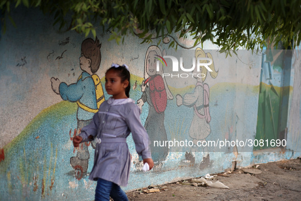 palestinian school girls walk at the Gaza City, on the first day of a new school year, in Gaza City August 29, 2018. 
 