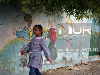 palestinian school girls walk at the Gaza City, on the first day of a new school year, in Gaza City August 29, 2018. 
 (