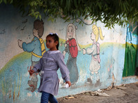 palestinian school girls walk at the Gaza City, on the first day of a new school year, in Gaza City August 29, 2018. 
 (