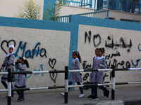 palestinian school girls walk at the Gaza City, on the first day of a new school year, in Gaza City August 29, 2018. 
 (