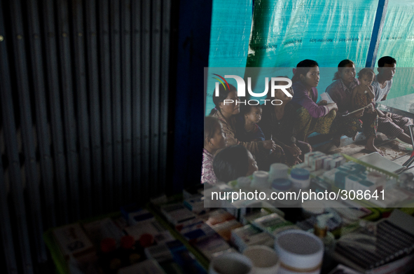 Phumi, Moat Khla, Tonle Sap, Cambodia. Villagers await treatment at the lake clinic.

The Tonle Sap Lake is situated in the heart of Cambo...