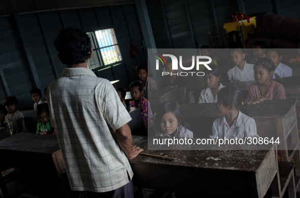 Phumi Pech Chakrei, Tonle Sap, Cambodia. Children take lessons in Khmer at a village 4 hours by longboat from the nearest shore.

The Tonl...