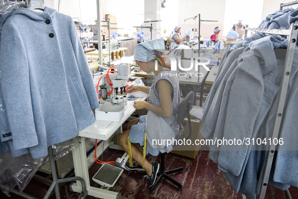 People at work in a factory for fabric tailoring, in Skvyra, Ukraine, on September 3, 2018. 