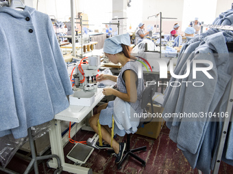 People at work in a factory for fabric tailoring, in Skvyra, Ukraine, on September 3, 2018. (