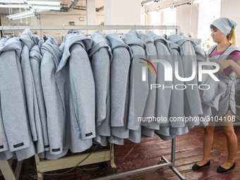 People at work in a factory for fabric tailoring, in Skvyra, Ukraine, on September 3, 2018. (