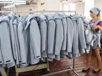 People at work in a factory for fabric tailoring, in Skvyra, Ukraine, on September 3, 2018. (