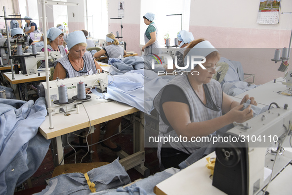 People at work in a factory for fabric tailoring, in Skvyra, Ukraine, on September 3, 2018. 