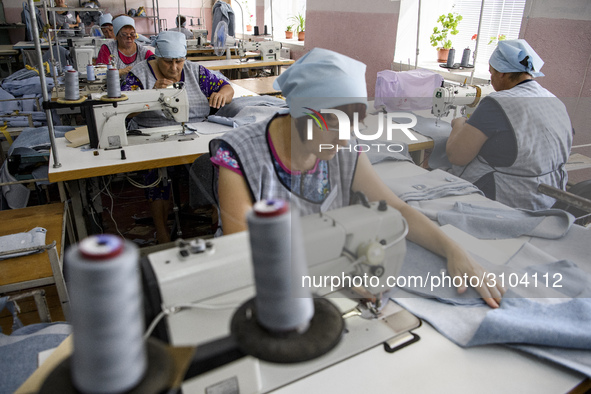 People at work in a factory for fabric tailoring, in Skvyra, Ukraine, on September 3, 2018. 