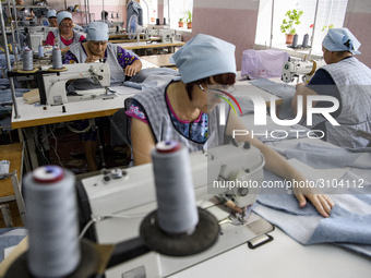 People at work in a factory for fabric tailoring, in Skvyra, Ukraine, on September 3, 2018. (