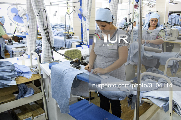 People at work in a factory for fabric tailoring, in Skvyra, Ukraine, on September 3, 2018. 