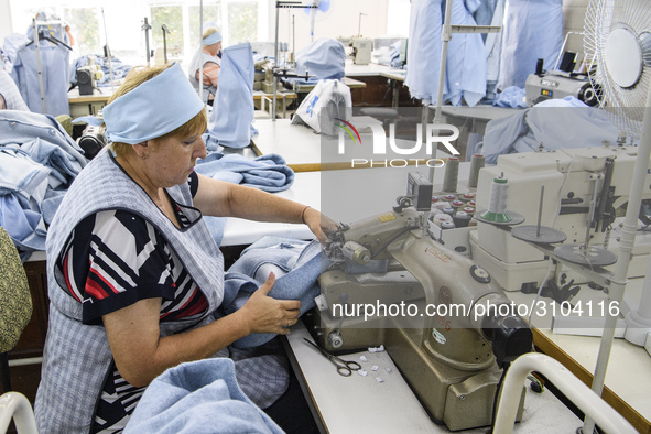 People at work in a factory for fabric tailoring, in Skvyra, Ukraine, on September 3, 2018. 