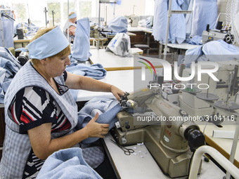 People at work in a factory for fabric tailoring, in Skvyra, Ukraine, on September 3, 2018. (