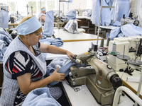 People at work in a factory for fabric tailoring, in Skvyra, Ukraine, on September 3, 2018. (