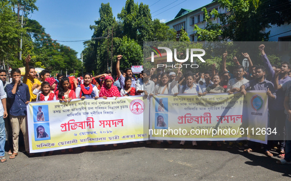 Cotton University and Handique Girls College students stage a protest by blocking road in front of office of the Deputy Commissioner, Kamrup...