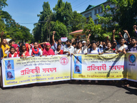 Cotton University and Handique Girls College students stage a protest by blocking road in front of office of the Deputy Commissioner, Kamrup...