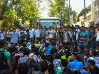 Cotton University and Handique Girls College students stage a protest by blocking road in front of office of the Deputy Commissioner, Kamrup...