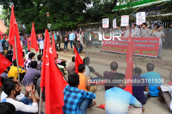 Activists from Bangladeshi garments organization stage demonstration in Dhaka rejecting the government’s decision to raise their minimum mon...