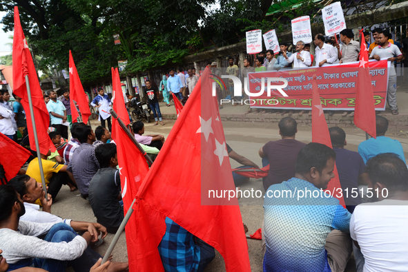 Activists from Bangladeshi garments organization stage demonstration in Dhaka rejecting the government’s decision to raise their minimum mon...