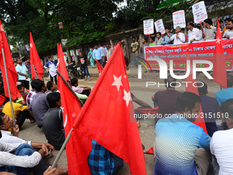 Activists from Bangladeshi garments organization stage demonstration in Dhaka rejecting the government’s decision to raise their minimum mon...