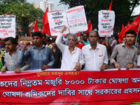 Activists from Bangladeshi garments organization stage demonstration in Dhaka rejecting the government’s decision to raise their minimum mon...