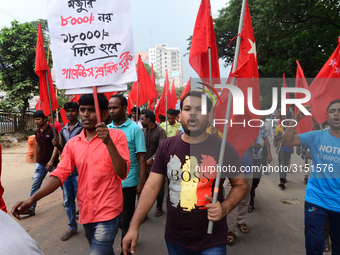 Activists from Bangladeshi garments organization stage demonstration in Dhaka rejecting the government’s decision to raise their minimum mon...