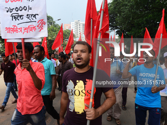 Activists from Bangladeshi garments organization stage demonstration in Dhaka rejecting the government’s decision to raise their minimum mon...