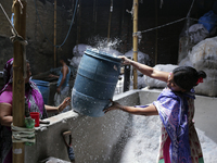 Women work in a polythene bag recycling factory in Kamrangirchar, Dhaka Bangladesh, on September 14, 2018. (