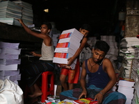 Children are working on a book binding factory in Dhaka, 27 September 2018.  (