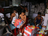 Children are working on a book binding factory in Dhaka, 27 September 2018.  (