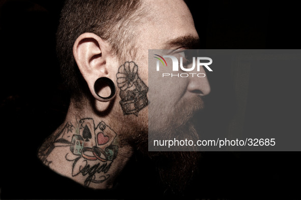 Portraits of tattooed people, in Milan, Italy. 